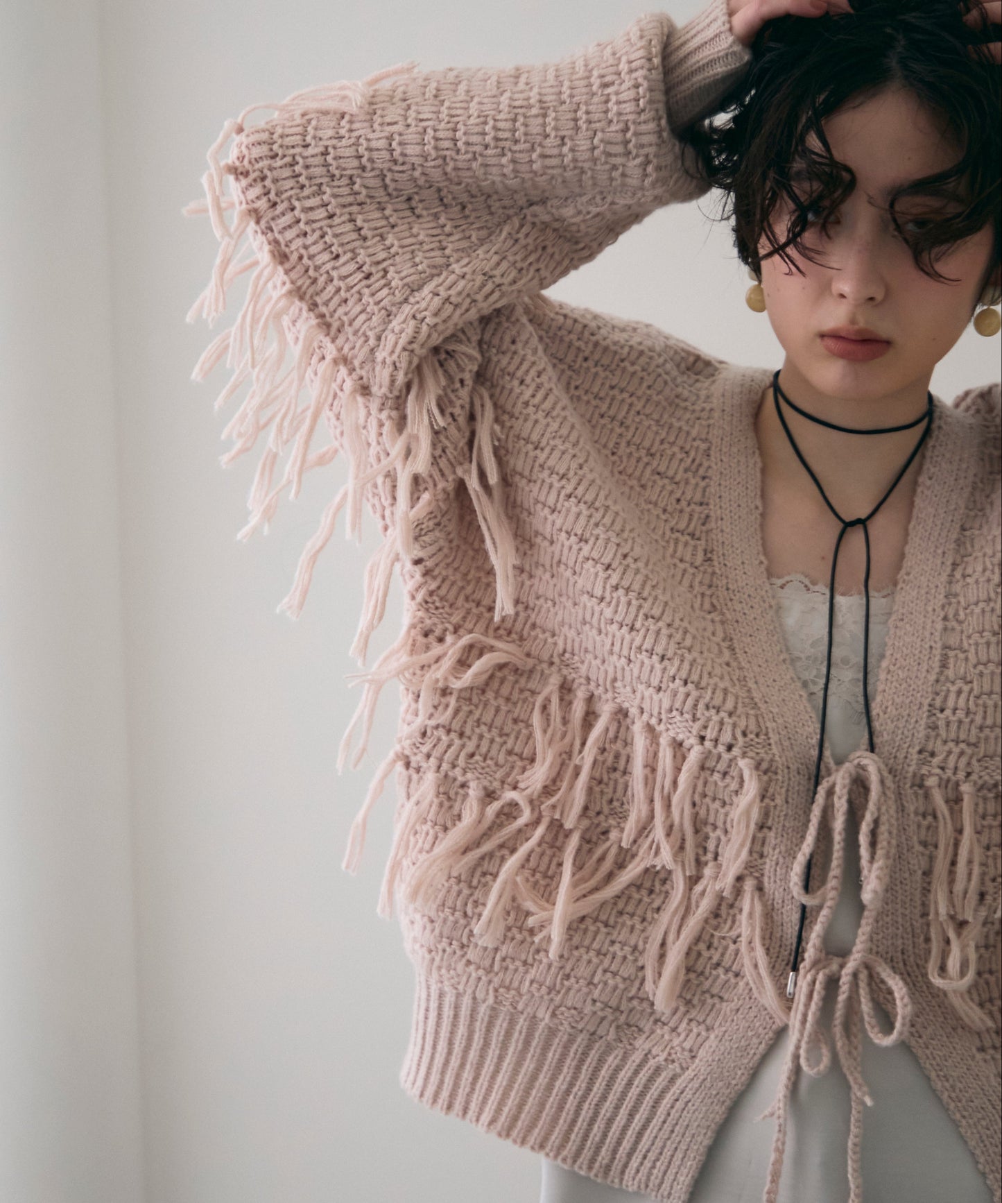 タック編み裏使いフリンジカーディガン