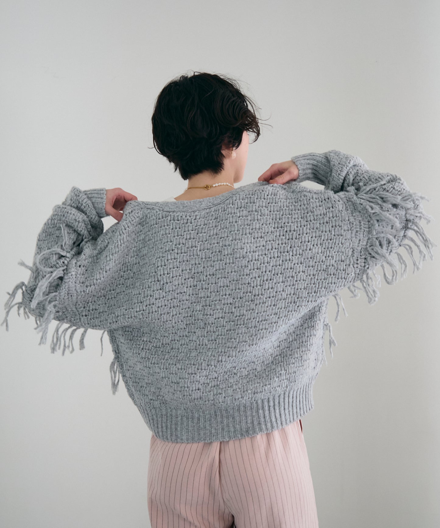 タック編み裏使いフリンジカーディガン