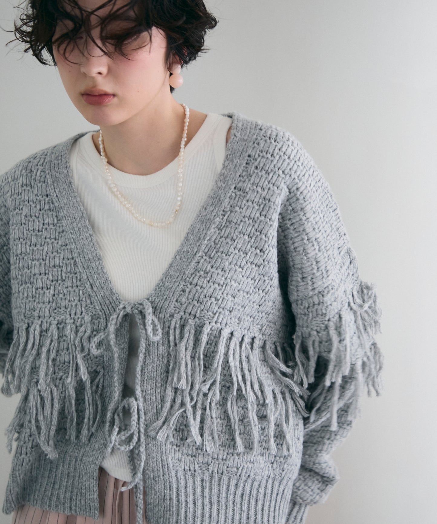 タック編み裏使いフリンジカーディガン